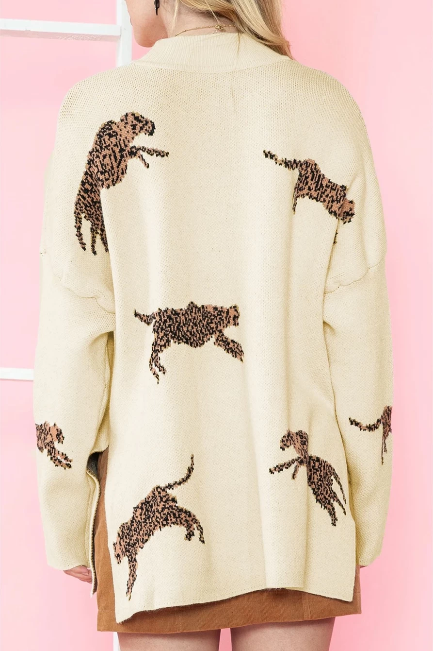 Shewin Women's Cheetah Print High Neck Split Hem Sweater in Parchment
