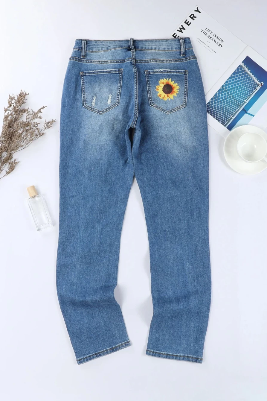 Shewin Women's Sky Blue Ripped Straight Leg Jeans with Sunflower Graphic Print Mid Rise Denim