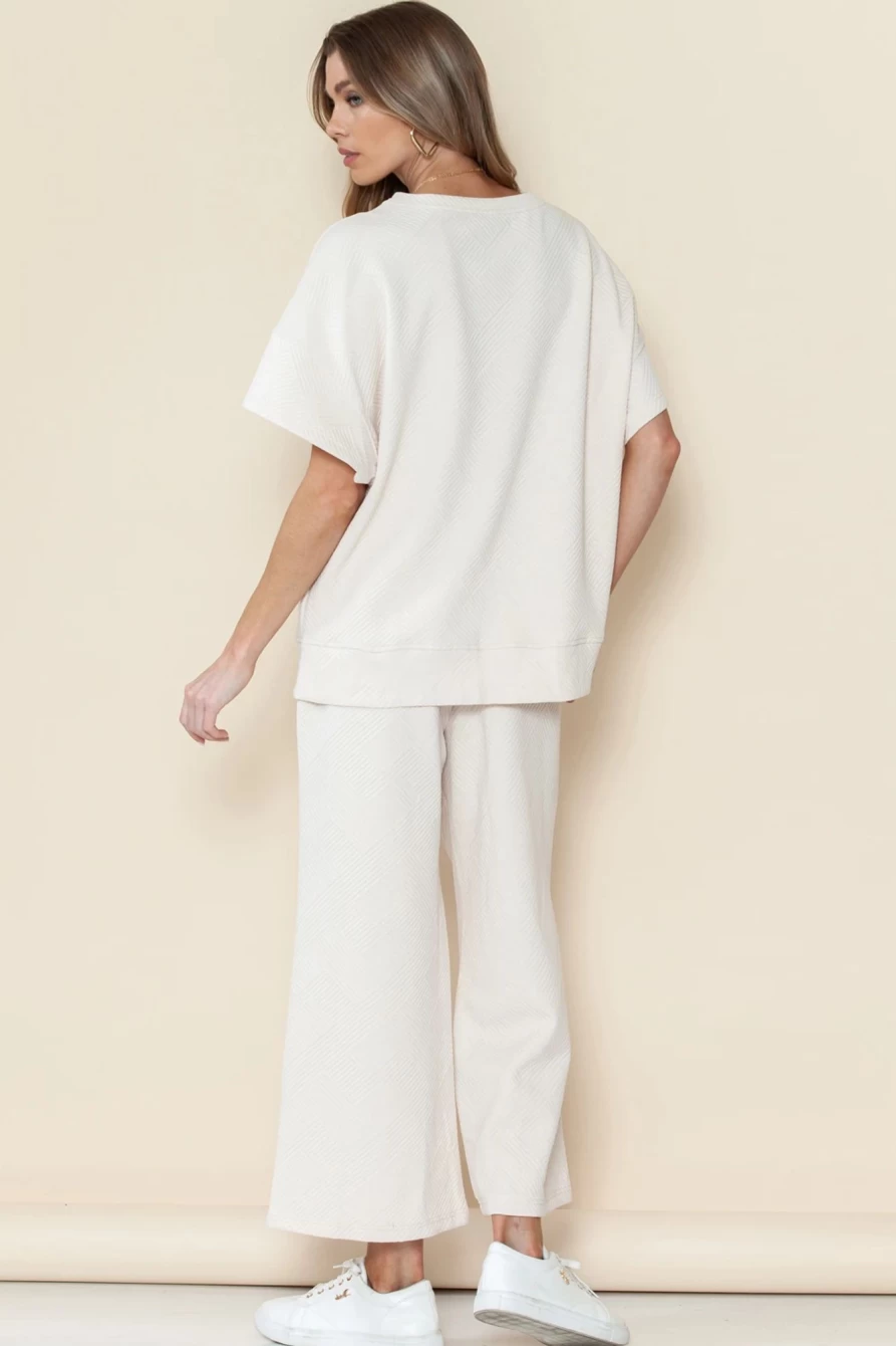 "Shewin Women's Bright White Textured Loose Fit T-Shirt & Drawstring Pants Set"