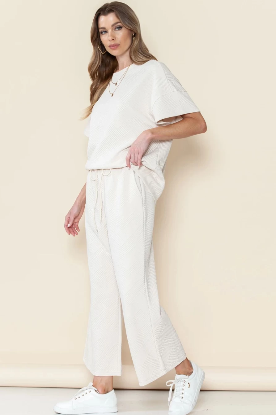 "Shewin Women's Bright White Textured Loose Fit T-Shirt & Drawstring Pants Set"