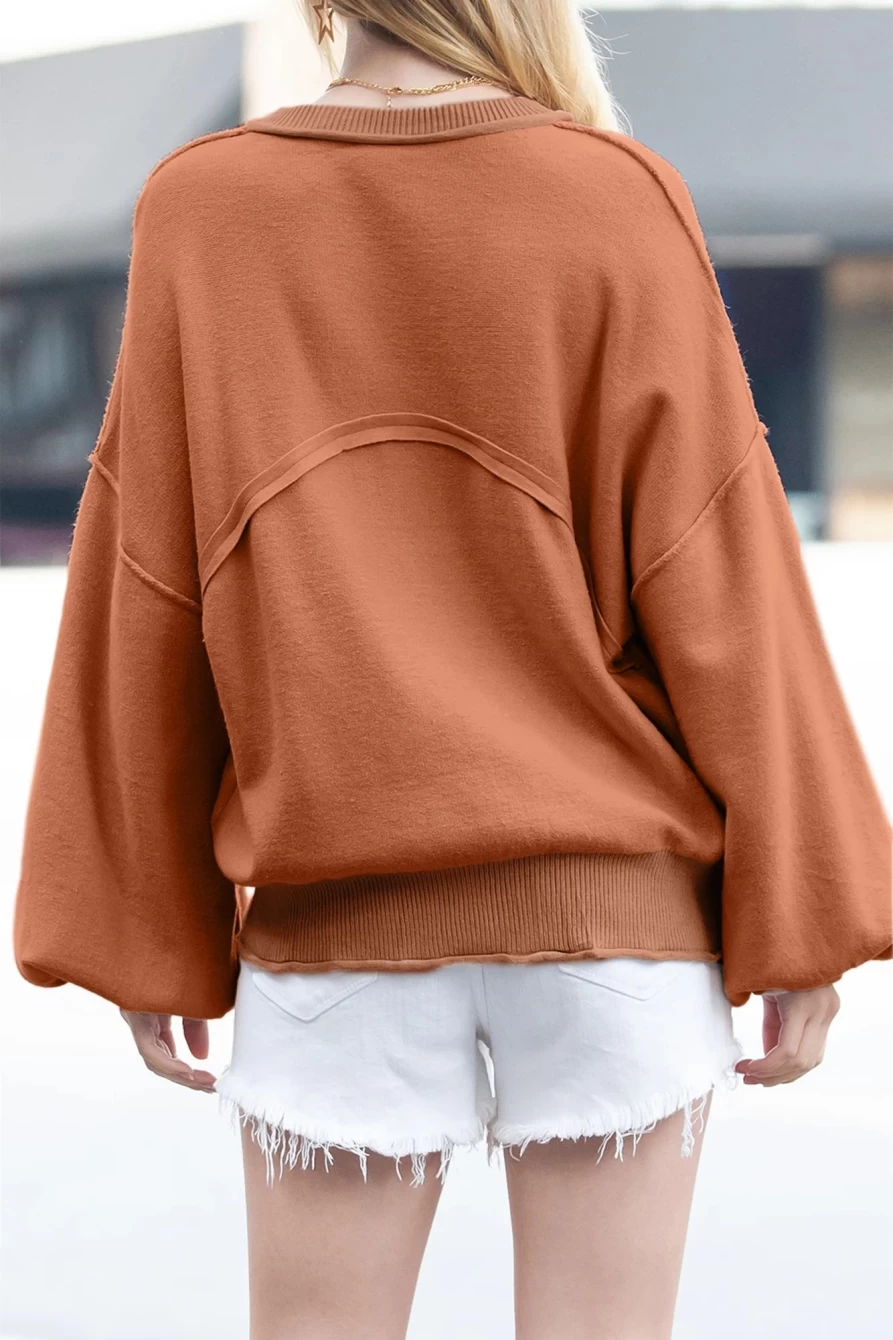 Shewin Women's Orange Lantern Sleeve Sweater with Raw Edge Pockets & Exposed Seams
