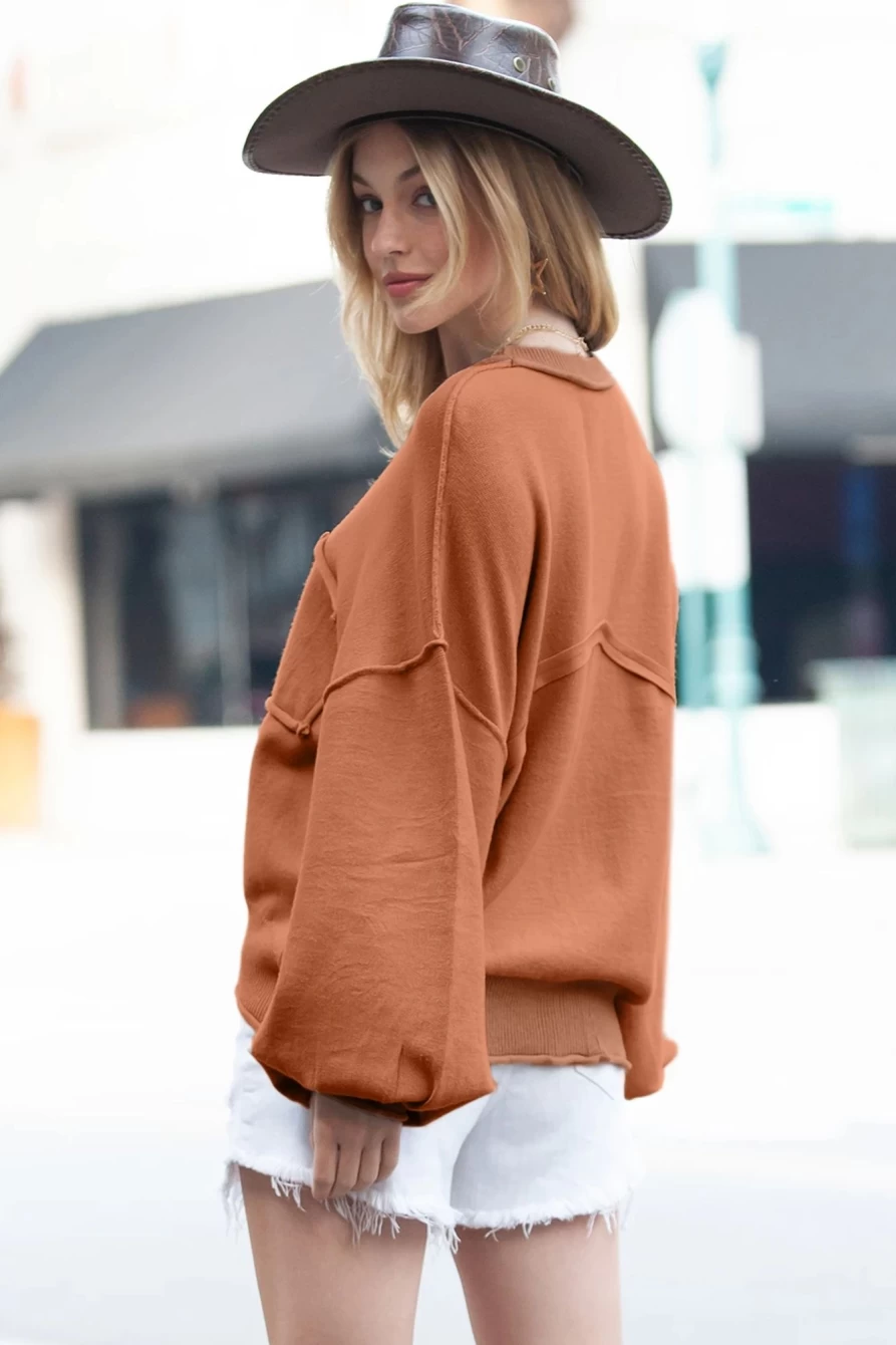 Shewin Women's Orange Lantern Sleeve Sweater with Raw Edge Pockets & Exposed Seams