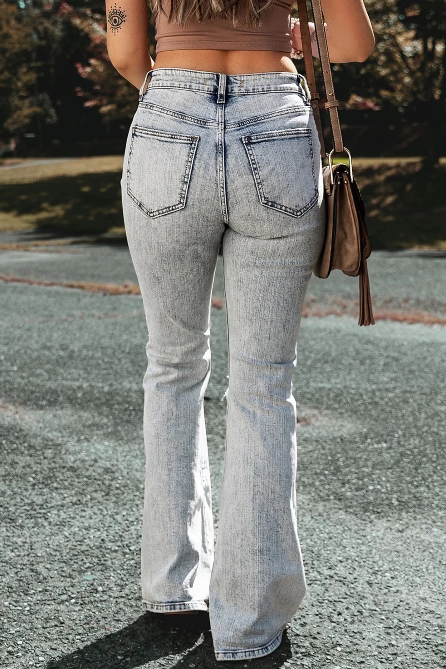 Shewin Women's Light Blue Distressed Washed Flared Jeans with Knee Slits