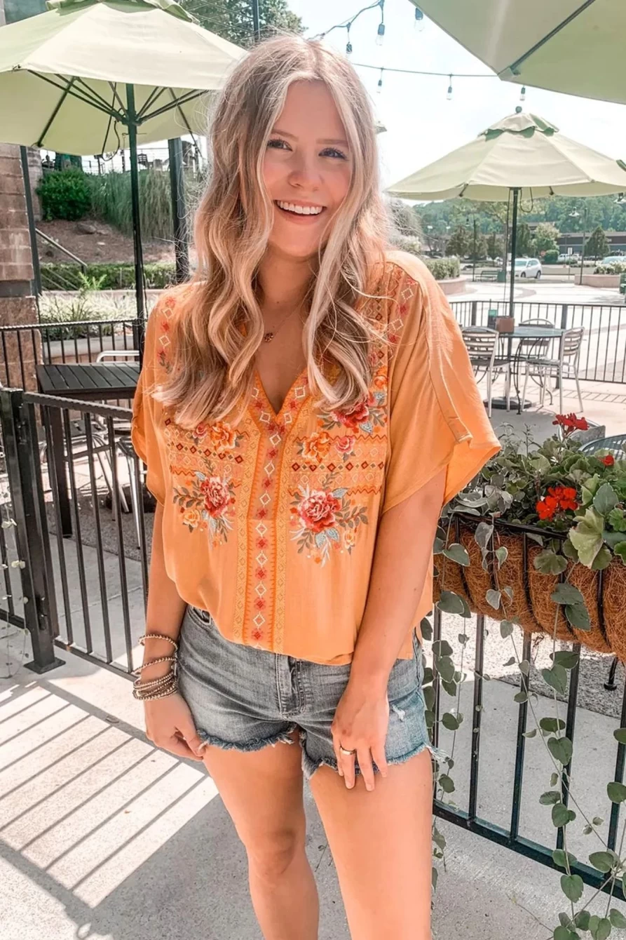 "Shewin Women's Floral Print V-Neck Blouse in Grapefruit Orange"